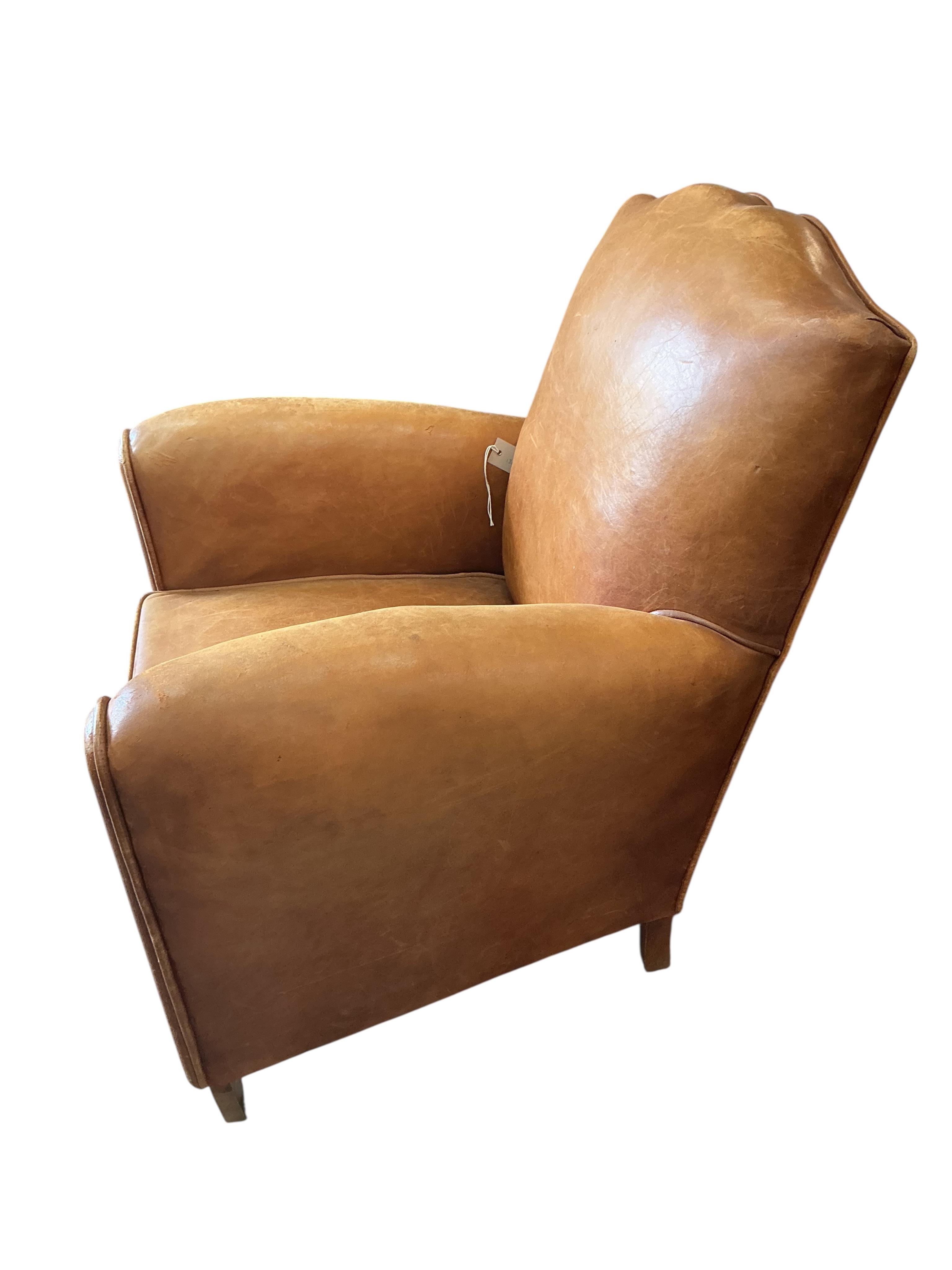 A French Art Deco tan leather club chair, width 73cm, depth 68cm, height 74cm